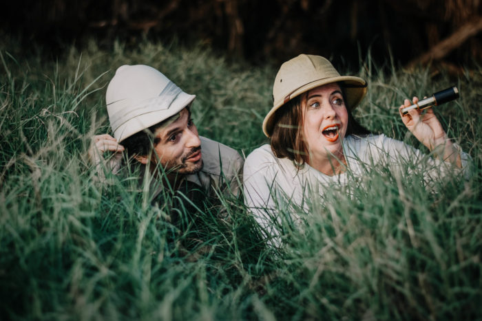 Two vintage treasure hunters in the grass.